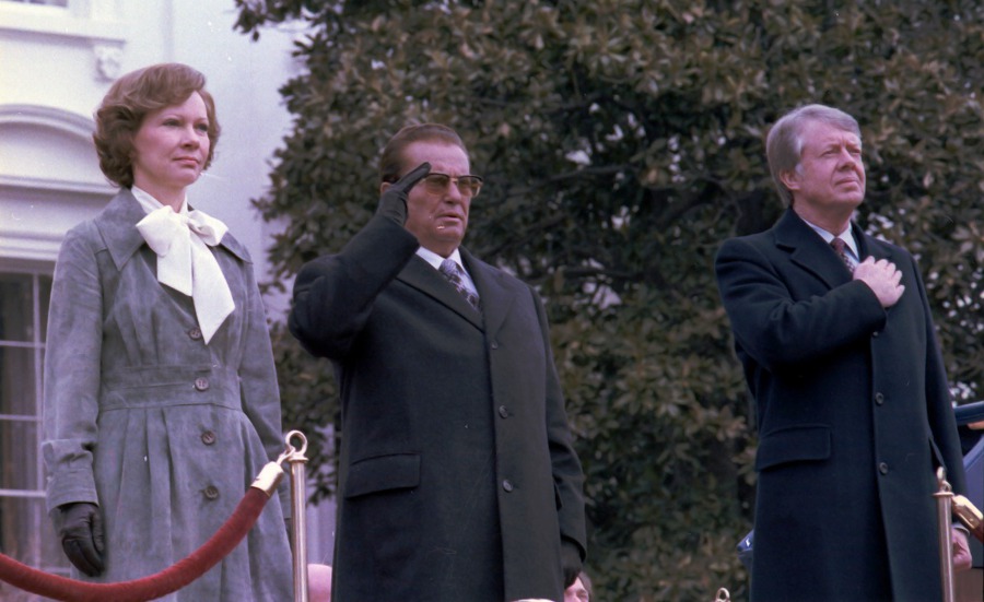 color photo of President and Mrs. Carter saluting the flag at the US White House upon the visit of Josip Tito in 1978